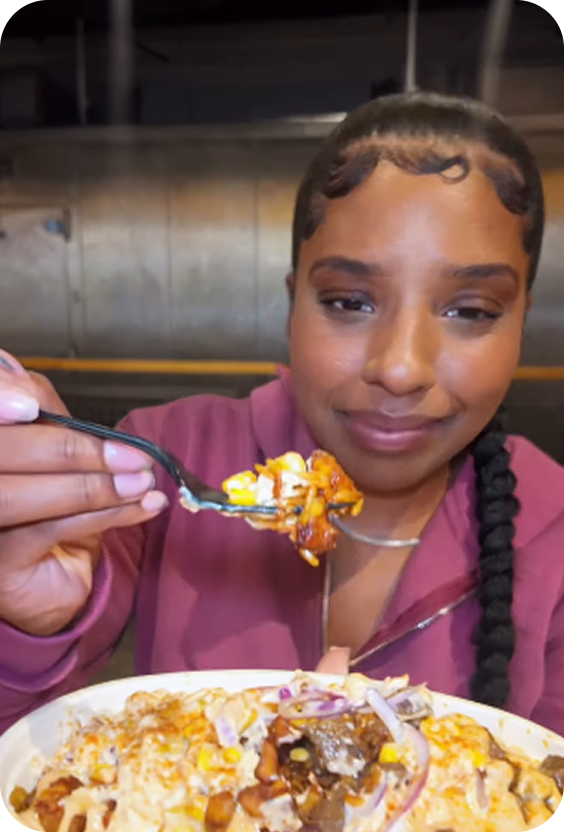 A guest enjoying her Jollof Bowl
